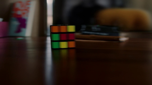 Video Reference: Rubiks cube, Puzzle, Toy, Light, Mechanical puzzle, Flooring, Colorfulness, Tints and shades, Floor