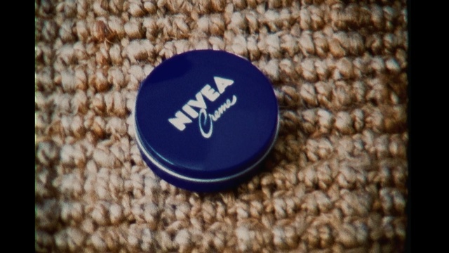 Video Reference: Cobalt blue, Font, Electric blue, Photography, Label, Fashion accessory, Badge, Bottle cap
