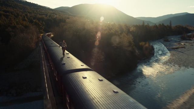 Video Reference: Water, Sky, Water resources, Sunlight, River, Mountain, Reservoir, Train, Roof, Running, Run, Man