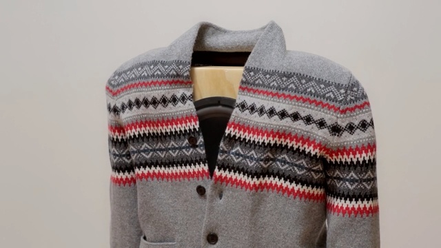 Video Reference: Woolen, Clothing, Outerwear, Sweater, Wool, Sleeve, Cardigan, Beige, Jacket, Knitting, Person