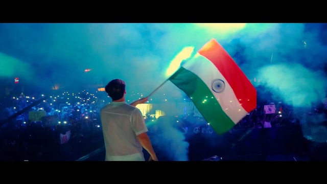 Video Reference: sky, light, entertainment, fun, photography, event, computer wallpaper, crowd, rave, smoke, Person