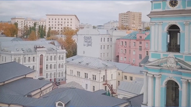 Video Reference: Landmark, Roof, Town, Building, Architecture, City, Human settlement, Neighbourhood, Urban area, Residential area, Person