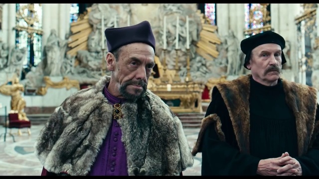 Video Reference: Headgear, Patriarch, Metropolitan bishop, Hieromonk, Archimandrite, Beard, Fur, Dastar, Person, Building, Man, Standing, Walking, Street, Front, Holding, People, Wearing, Older, Woman, City, Suit, Large, Old, Phone, Talking, Hat, White, Group, Shirt, Room, Bus, Umbrella, Riding, Human face, Clothing, Scarf