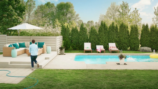 Video Reference: swimming pool, leisure, property, backyard, water, plant, grass, estate, house, yard, Person