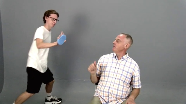 Video Reference: Arm, Joint, Person, Game, Sport, Man, Racquetball, Indoor, Playing, Standing, Holding, Young, People, Boy, Court, Racket, Couple, Woman, Video, Group, Water, Room, Player, Living, Ball, Athletic game, Clothing, Shirt, Human face