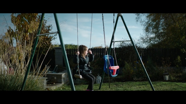 Video Reference: swing, nature, outdoor play equipment, tree, grass, sky, plant, public space, fun, leisure, Person