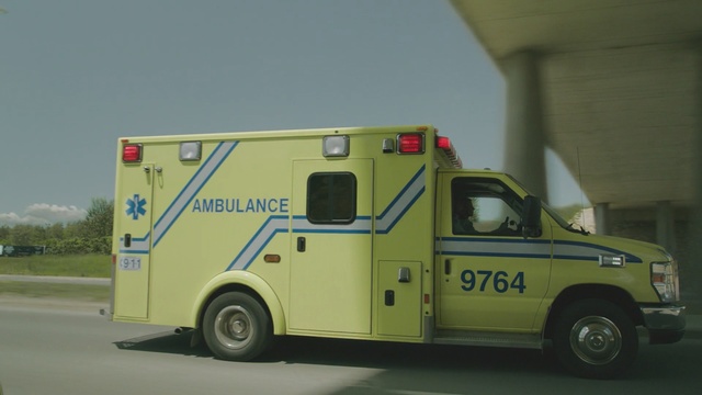 Video Reference: motor vehicle, vehicle, ambulance, car, emergency vehicle, mode of transport, emergency, automotive exterior, commercial vehicle, public utility, Person
