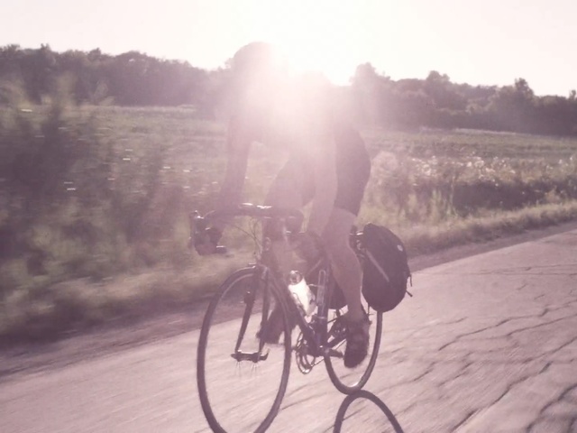 Video Reference: bicycle, land vehicle, cycling, road bicycle, mode of transport, lane, sky, snapshot, morning, road cycling