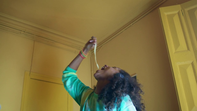 Video Reference: Green, Ceiling, Yellow, Wall, Fun, Room, Facial hair, House, Long hair, Plaster