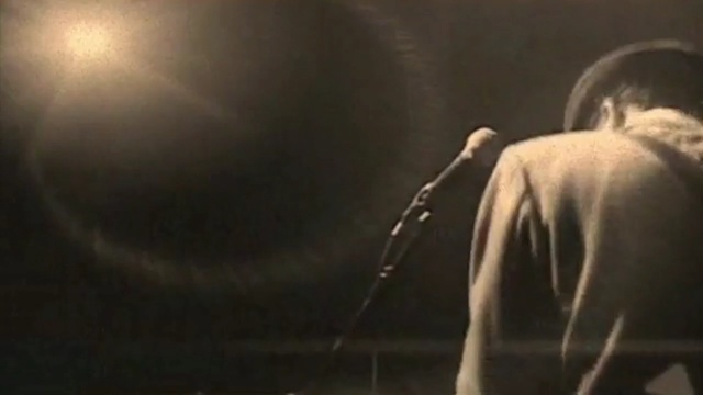 Video Reference: darkness, human, facial hair, event, performance, scene, song