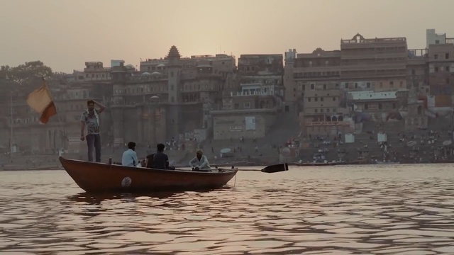 Video Reference: water transportation, water, waterway, boating, boat, sky, morning, sea, watercraft, vehicle, Person