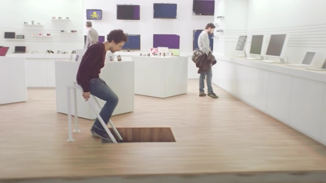 Video Reference: floor, furniture, flooring, exhibition, wood, table, hardwood, wood flooring, Person