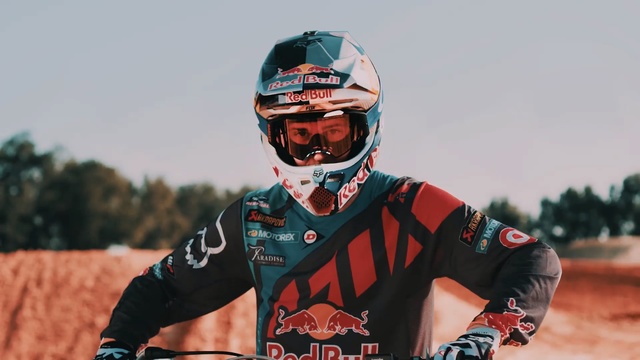 Video Reference: helmet, protective gear in sports, headgear, personal protective equipment, protective equipment in gridiron football, race, racing, car, vehicle, competition event, Person