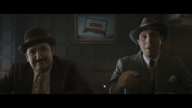 Video Reference: Movie, Gentleman, Screenshot, Darkness, Human, Fedora, Headgear, Fun, Hat, Facial hair, Person