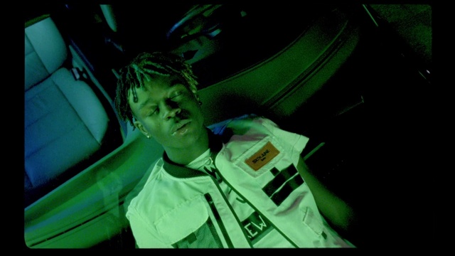 Video Reference: Green, Photography, Fictional character, Space, Indoor, Monitor, Person, Dark, Man, Wearing, Television, Screen, Sitting, Photo, Front, Looking, Holding, Suit, Young, Standing, Room, Lit, Light, Smiling, Computer, Video, Table, Laptop, Woman, Cat, Remote, Playing, Laying, Bed, Human face, Clothing, Text