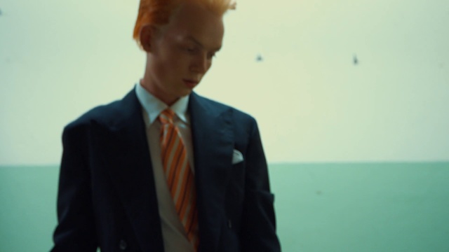 Video Reference: Suit, Formal wear, Photograph, Standing, Tie, Tuxedo, Outerwear, White-collar worker, Snapshot, Fun