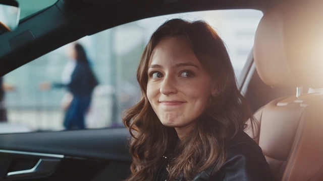 Video Reference: Face, Hair, Beauty, Head, Lip, Automotive design, Vehicle, Eye, Brown hair, Smile