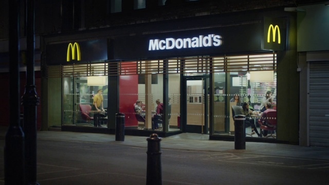 Video Reference: Building, Urban area, Night, Street, Architecture, Facade, City, Signage, Person