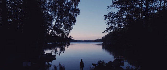 Video Reference: water, reflection, nature, sky, body of water, lake, tree, river, evening, atmosphere, Person