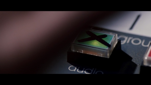 Video Reference: Green, Text, Font, Automotive design, Logo, Close-up, Macro photography, Photography, Technology, Graphic design, Laptop, Sitting, Computer, Sign, Table, Dark, Close, Keyboard, Desk, Remote, Street, Phone, Traffic, White, Screenshot, Design