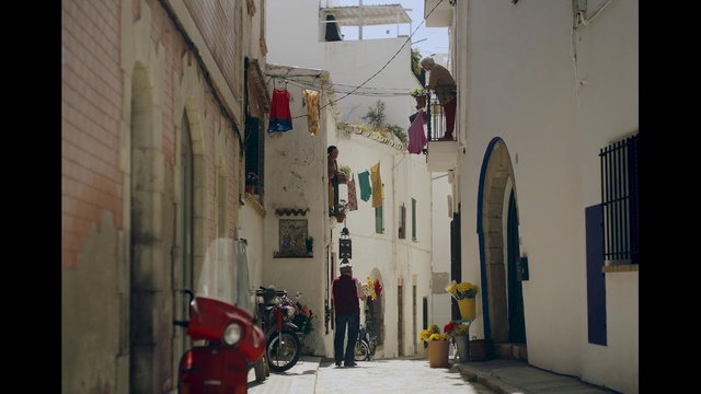 Video Reference: Alley, Street, Neighbourhood, Town, Road, Infrastructure, Building, Architecture, Facade, Nonbuilding structure