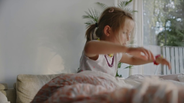 Video Reference: Bed, Shoulder, Blond, Room, Child, Bed sheet, Furniture, Textile, Dress, Photography