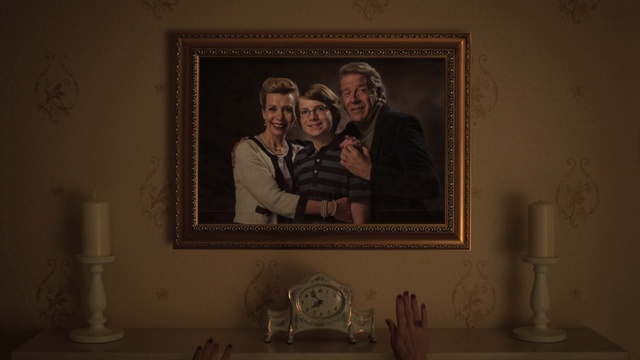 Video Reference: room, picture frame, art, darkness, window, portrait, house, Person