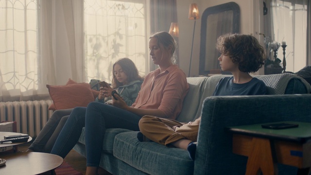 Video Reference: Sitting, Room, Interaction, Conversation, Furniture, Technology, Couch, Electronic device, Interior design, Vacation