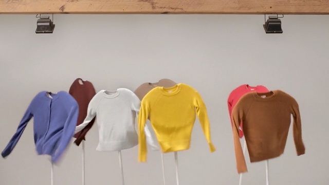 Video Reference: Clothes hanger, T-shirt, Yellow, Outerwear, Room, Sleeve, Sportswear, Top, Sweater