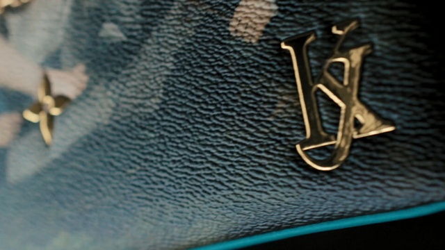 Video Reference: electric blue, zipper, handbag, font, metal, brand, product