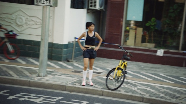 Video Reference: land vehicle, bicycle, cycle sport, vehicle, road, lane, infrastructure, street, snapshot, sports equipment