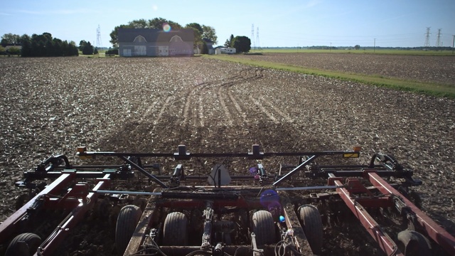 Video Reference: field, grass, vehicle, agriculture, grass family, plant, sky