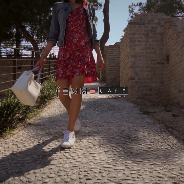 Video Reference: White, Clothing, Fashion, Brown, Dress, Maroon, Snapshot, Street fashion, Footwear, Waist, Outdoor, Person, Holding, Woman, Young, Girl, Playing, Standing, Ball, Dressed, Wearing, Little, Man, Umbrella, Boy, Hand, Red, Walking, Frisbee, Street, Hat, Dirt, Field, Baseball, Ground, Fashion accessory, Skirt, Shorts, Miniskirt, Trousers