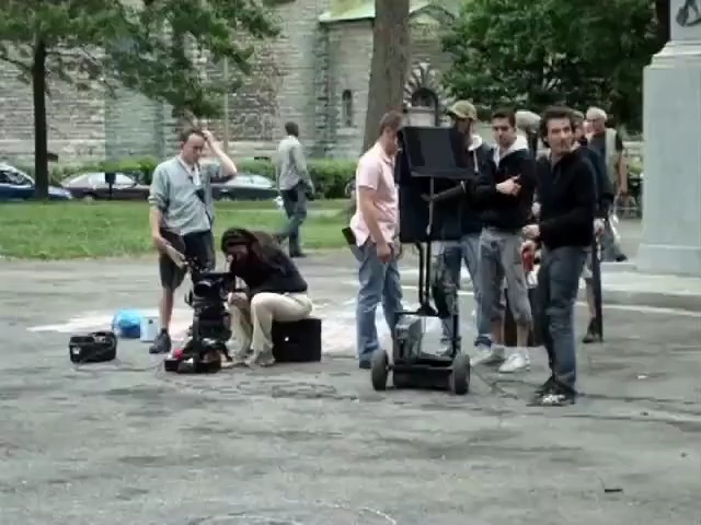 Video Reference: land vehicle, segway, vehicle, footwear, mammal, mode of transport, car, public space, asphalt, recreation, Person