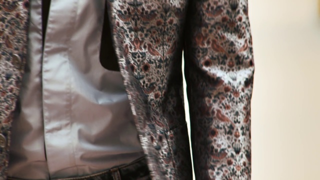 Video Reference: Clothing, Brown, Leggings, Outerwear, Trousers, Textile, Sleeve, Pattern, Pajamas, Jeans, Person