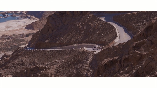 Video Reference: ridge, geological phenomenon, mountain, geology, sky, escarpment, elevation, glacial landform, summit, aerial photography