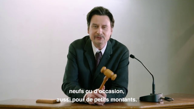 Video Reference: Public speaking, Microphone, Speech, Spokesperson, Orator, Microphone stand, Speaker, Audio equipment, Sitting, Suit