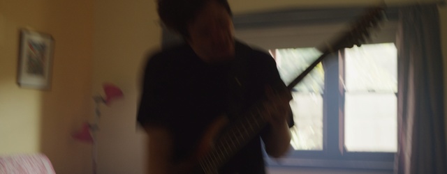 Video Reference: Black, Shoulder, Ceiling, Arm, Standing, Joint, Fun, Room, Human body, Hand, Person, Indoor, Looking, Mirror, Man, Window, Front, Woman, Sitting, Reflection, Young, Holding, Computer, Head, Laptop, Table, Blurry, Red, Kitchen, Food, Bed, Brushing, White, Shirt, Living, Teeth, Video, Cat, Musical instrument, Guitar, Human face