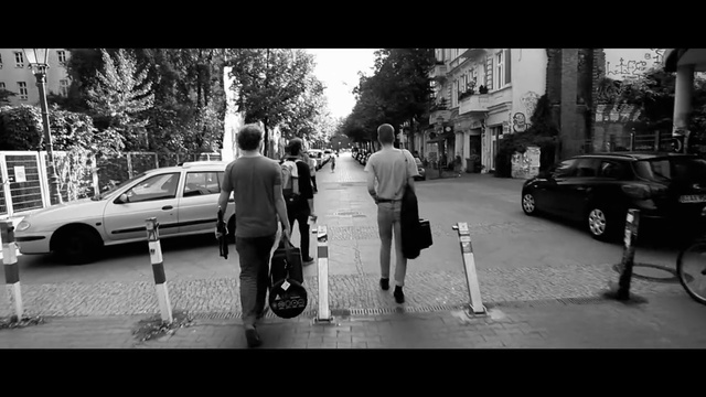 Video Reference: Photograph, Black, White, Black-and-white, Street, Vehicle, Car, Luxury vehicle, Pedestrian, Snapshot