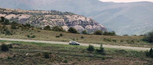 Video Reference: Mountainous landforms, Vehicle, Highland, Mountain, Plant community, Car, Hill station, Road, Mode of transport, Mountain pass