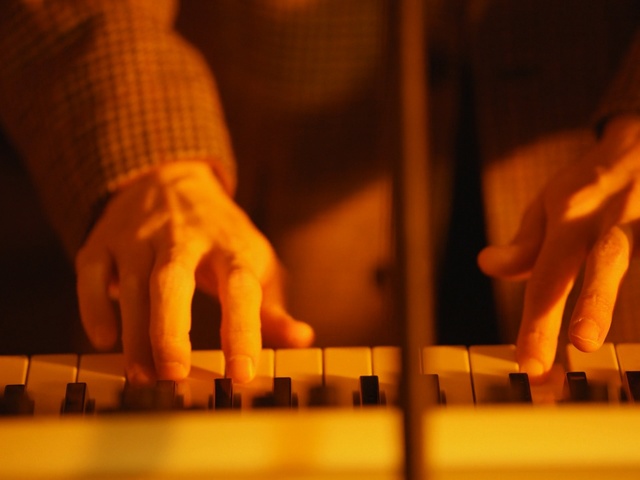Video Reference: yellow, hand, finger, light, string instrument, human body, keyboard, musical instrument accessory, heat, arm