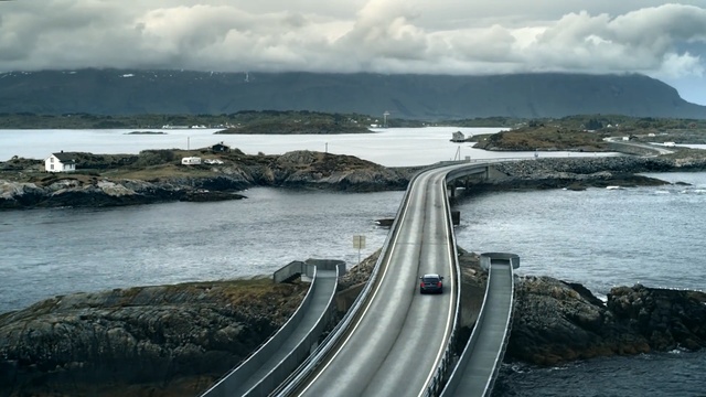 Video Reference: sea, fixed link, coastal and oceanic landforms, road, headland, coast, cloud, sky, terrain, ocean