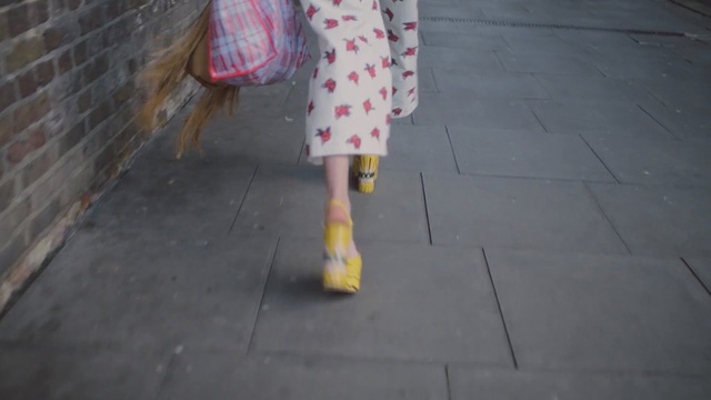 Video Reference: yellow, floor, leg, road surface, sidewalk, flooring, asphalt, wood, shoe, concrete