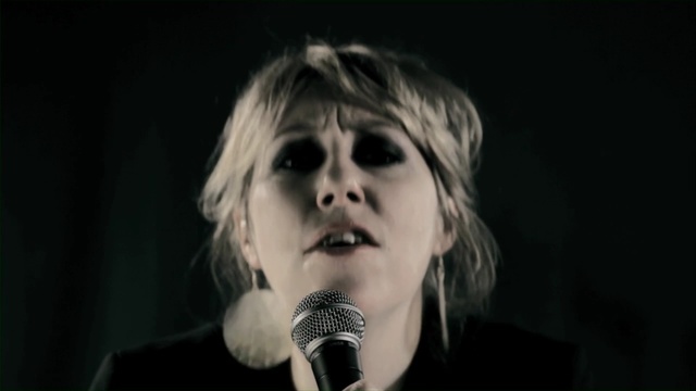 Video Reference: hair, black, human hair color, black and white, singer, human, girl, microphone, darkness, singing