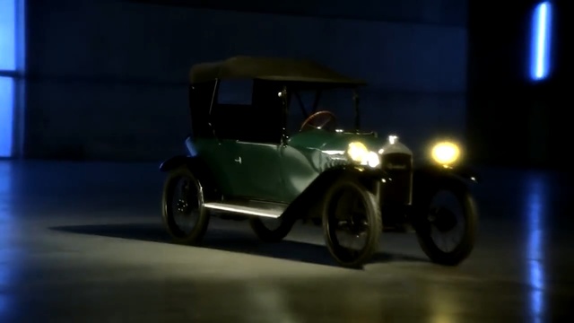Video Reference: car, studio, motor vehicle, vehicle, vintage car, mode of transport, automotive design, automotive exterior, electric vehicle, compact car, city car