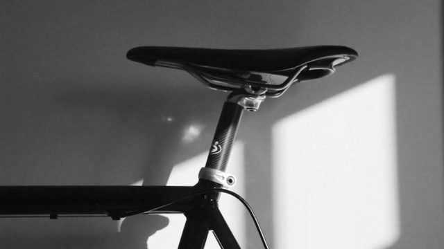 Video Reference: bicycle saddle, bicycle frame, black and white, bicycle part, bicycle, monochrome photography, monochrome, product, sports equipment, bicycle handlebar