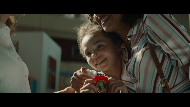 Video Reference: Facial expression, People, Movie, Skin, Human, Snapshot, Smile, Fun, Organ, Eye, Person, Indoor, Man, Holding, Looking, Woman, Young, Girl, Video, Sitting, Remote, Table, Hand, Smiling, Boy, Room, Close, Little, Game, Playing, Screen, Bed, Living, Television, Shirt, Mouth, White, Food, Wii, Standing, Human face, Child, Baby, Toddler, Clothing