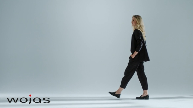 Video Reference: White, Clothing, Shoulder, Standing, Fashion, Fashion model, Joint, Footwear, Leg, Outerwear