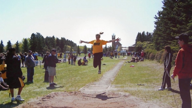 Video Reference: community, recreation, tree, sports, vehicle, tourism, walking, crowd, race, competition event, Person