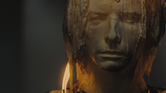 Video Reference: Face, Head, Human, Art, Portrait, Photography, Sculpture, Visual arts, Looking, Building, Standing, Dark, Black, Camera, Man, Cow, Front, Holding, Hair, Mirror, White, Wearing, Reflection, Room, Food, Red, Statue, Human face, Person, Bust